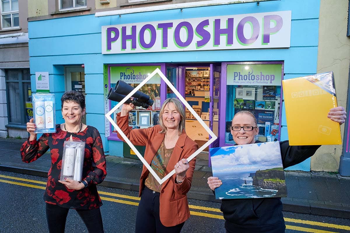 The Ennis Photoshop crew, Helena, Pat, and Elaine, outside the store